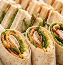 Close-up of tortilla wraps filled with chicken, salad leaves and peppers